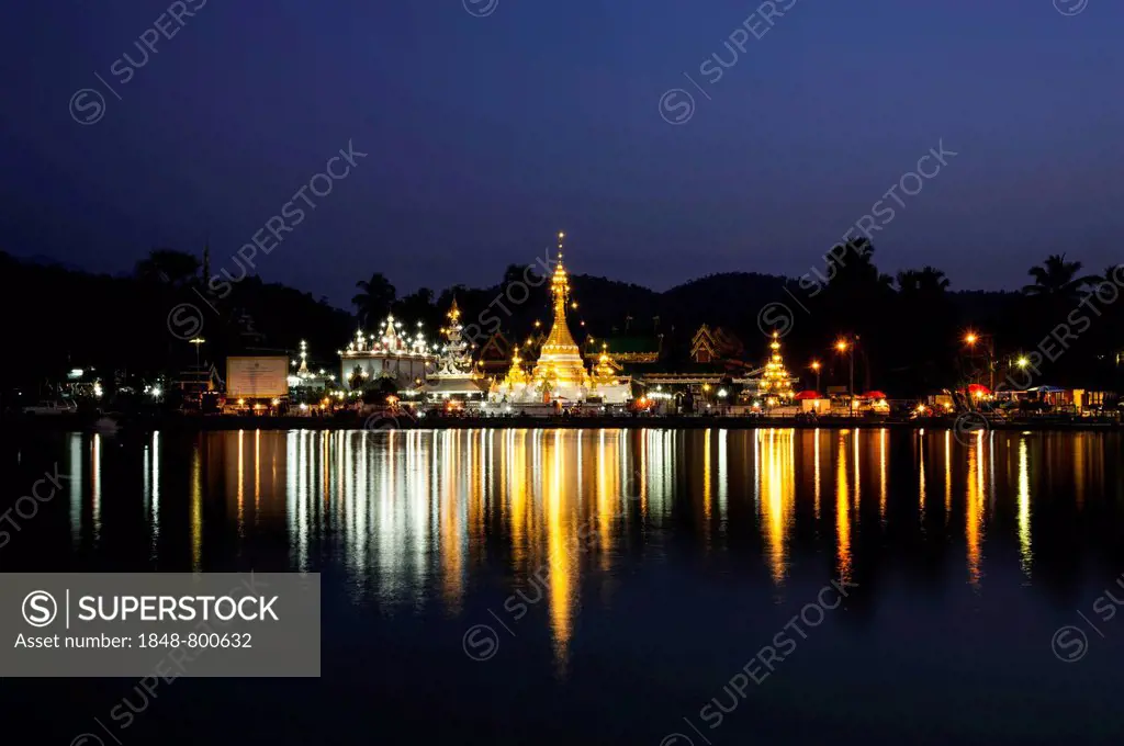 Pagoda or Chedi at dusk, magic hour, reflections in the Nong Jong Kham Lake, temple complex of Wat Jong Kham or Chong Kham and Wat Jong Klang or Chong...