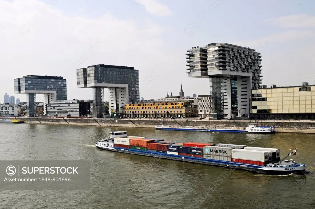 Cargo ship, crane towers, office buildings, residential buildings, Rhine, Rheinauhafen, Cologne, Rhineland, North Rhine-Westphalia, Germany