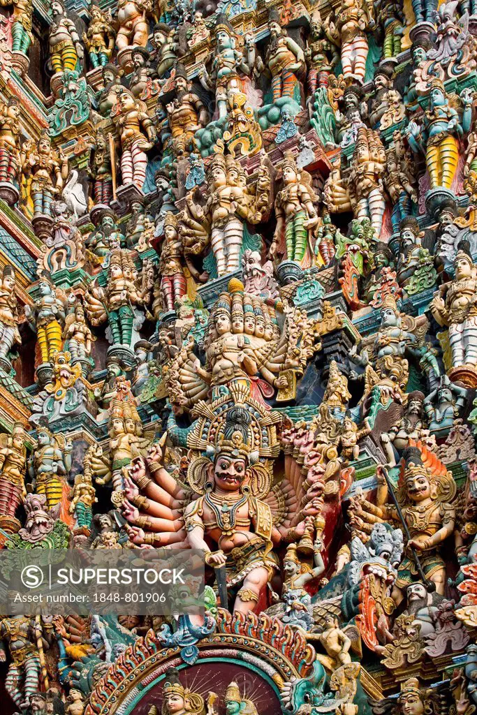 Colourful statues of gods and demons on the Gopuram or Gopura gate tower, Meenakshi Amman Temple or Sri Meenakshi Sundareswarar Temple, Madurai, Tamil...