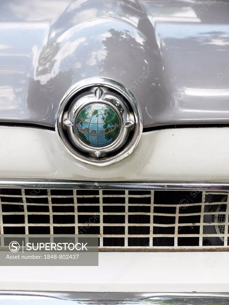 Emblem of a Ford Taunus classic car with a globe, Germany