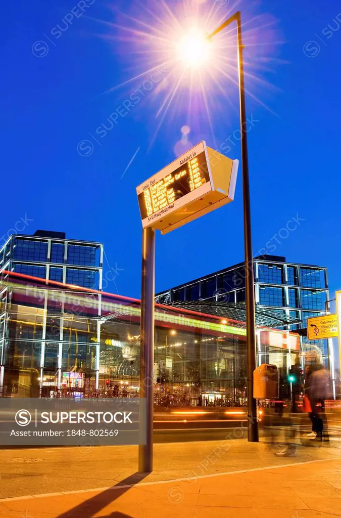 Busstop, in front of Berlin Central Station with driving bus in the evening, Berlin, Germany