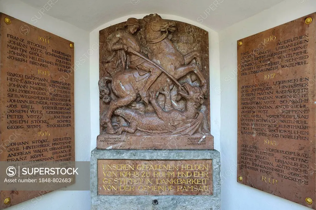 Relief of St. George slaying the Dragon, memorial plaques of the fallen in the First World War, 1914-1918, at the parish church of St. Sebastian, Rams...