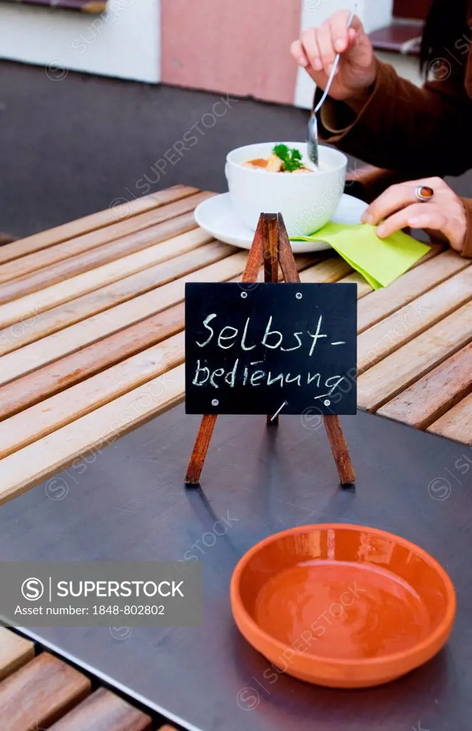 Self-service. Sign on a table of a road cafe.