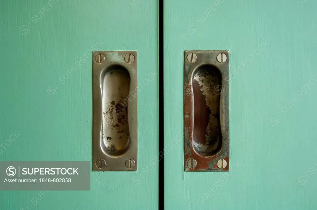 Finger pulls on a green door in the scullery in the master-house Kandinsky Klee, Bauhaus, Dessau, Germany