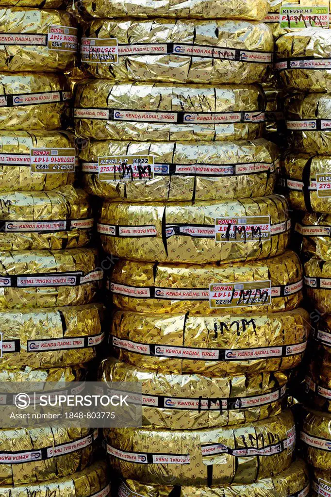Kenda off-road tyres wrapped in gold foil, packed for loading on Dubai Creek, Dubai, United Arab Emirates, Middle East, Asia
