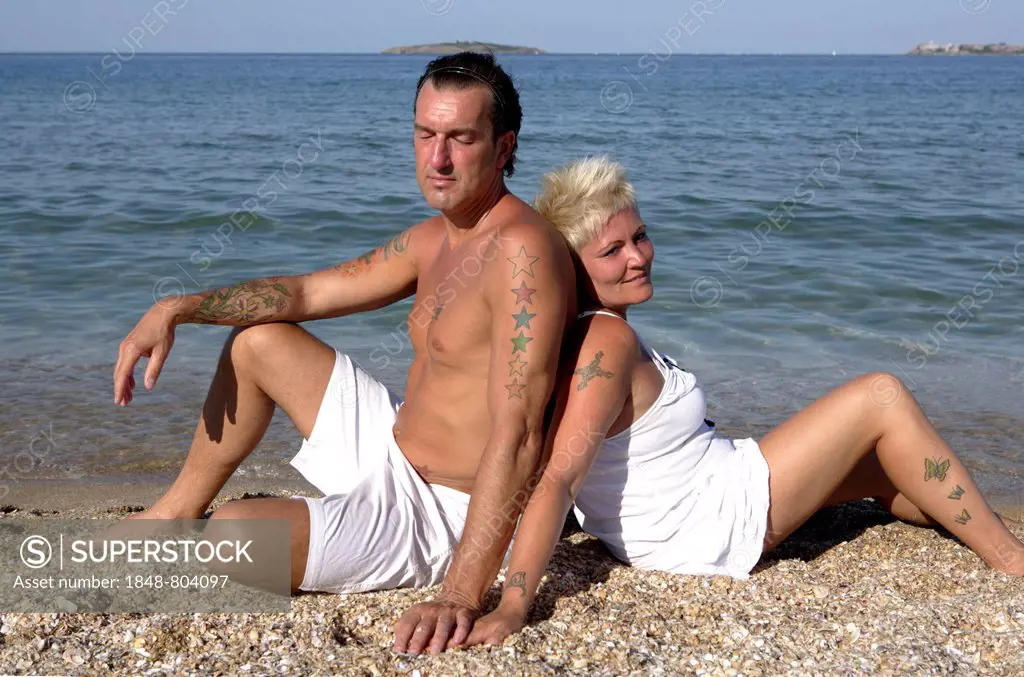 Couple, 41, 50 years, on the beach, beach holiday