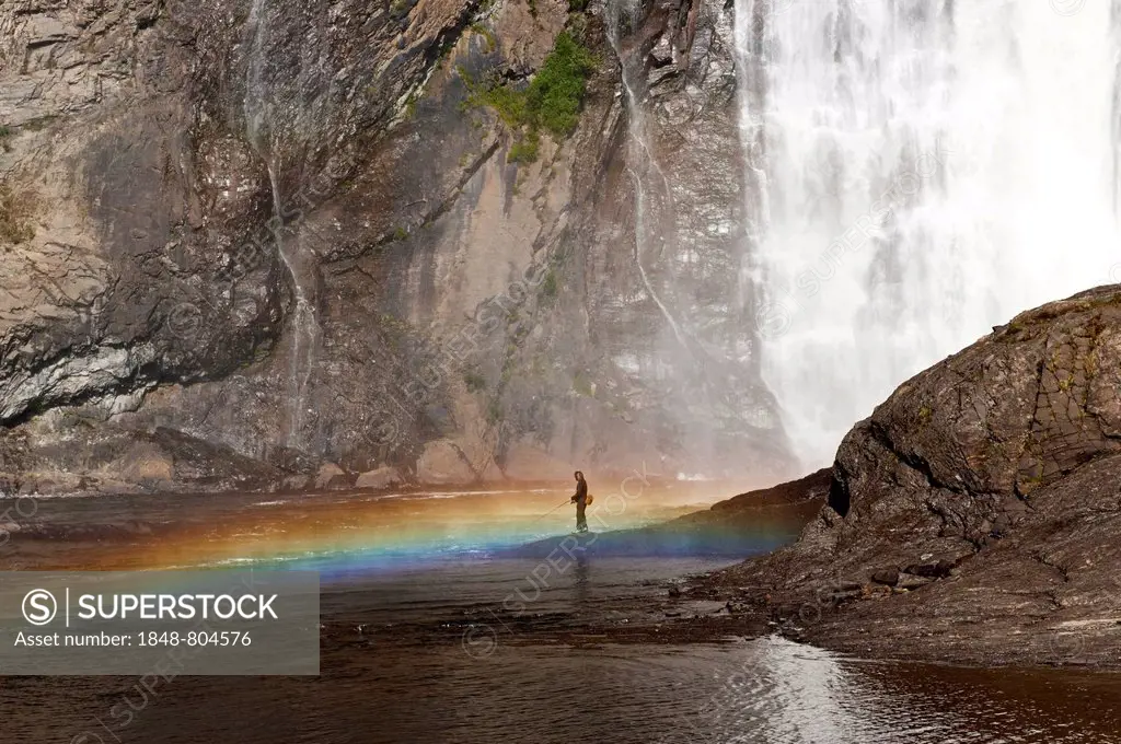 Angler in front of the waterfall, Parc de la Chute Montmorency, Montmorency Falls, Quebec, Canada, North America