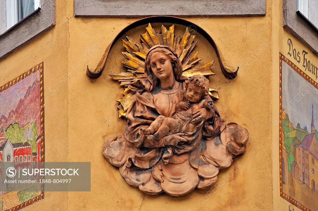 Relief of the Virgin Mary with the infant Jesus on the façade of the building Altes Brodhaus, Bad Reichenhall, Berchtesgadener Land District, Upper Ba...