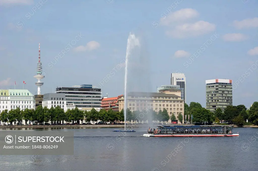 View over the Inner Alster Lake with Alster Fountain and an Alster excursion boat towards the street of Neuer Jungfernstieg, Hotel Vier Jahreszeiten o...
