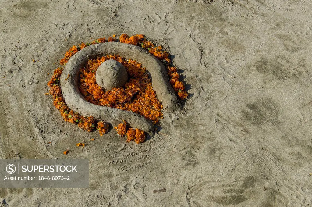 Shiva Lingam made of sand and flowers, during Kumbha Mela, Allahabad, Uttar Pradesh, India
