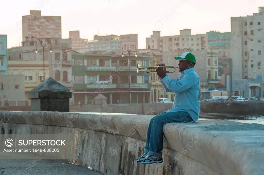 A man playing the trumpet at the Malecón, Havana's seaside promenade, Havana, La Habanna, Cuba