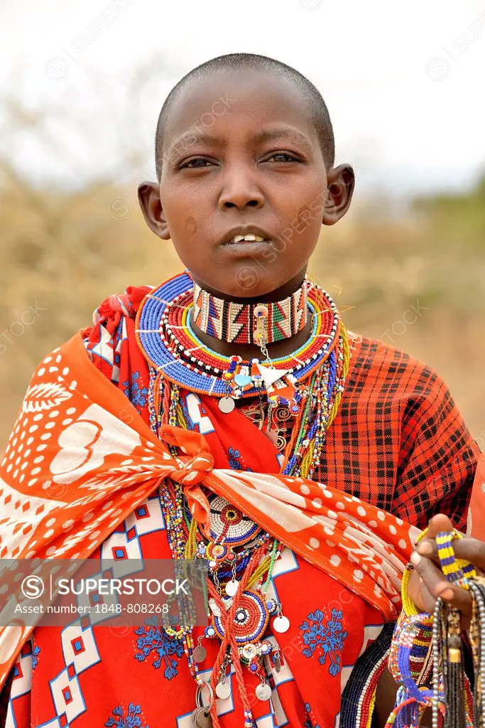 Maasai woman wearing traditional costume, Amboseli National Park, Rift Valley Province, Kenya