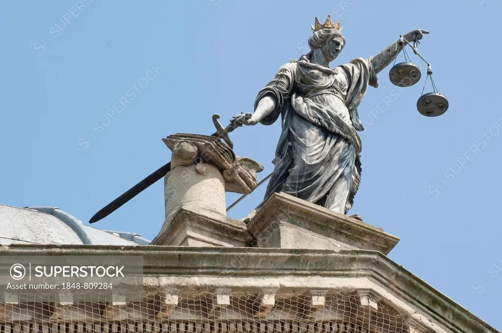 Justice holding her sword and scales, sculpture on the Guildhall, Bath, England, United Kingdom