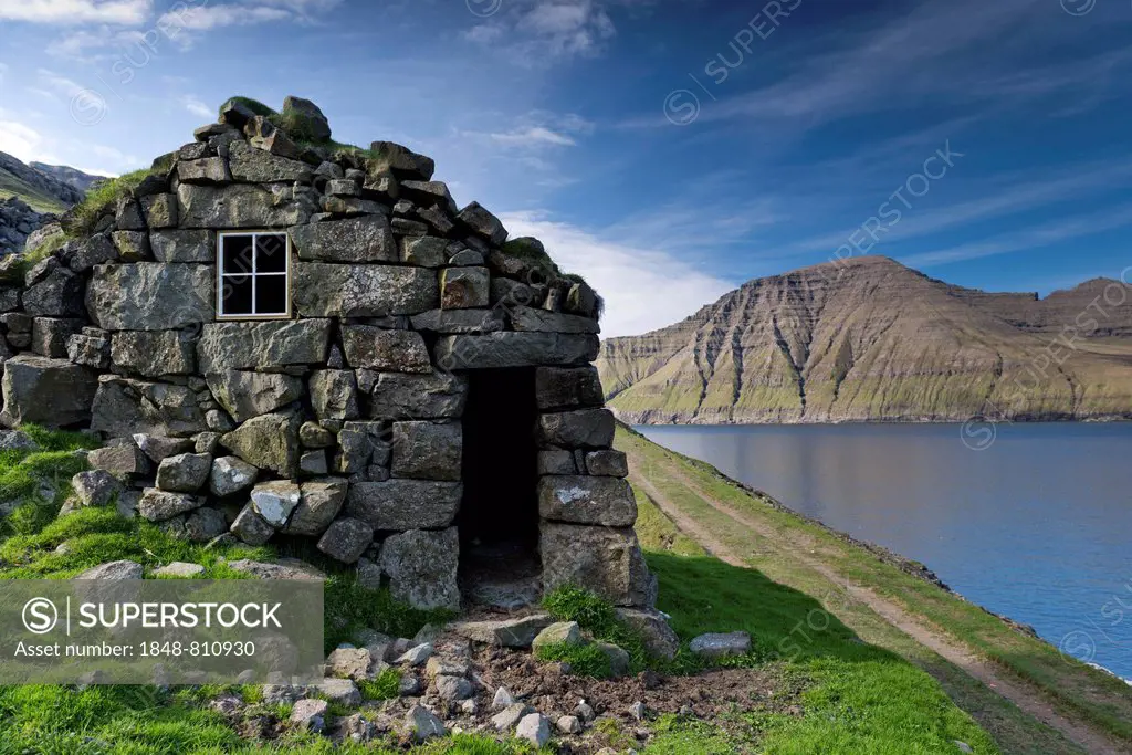 Old stone house on a fjord, Borðoy, Norðoyar, Faroe Islands, Denmark