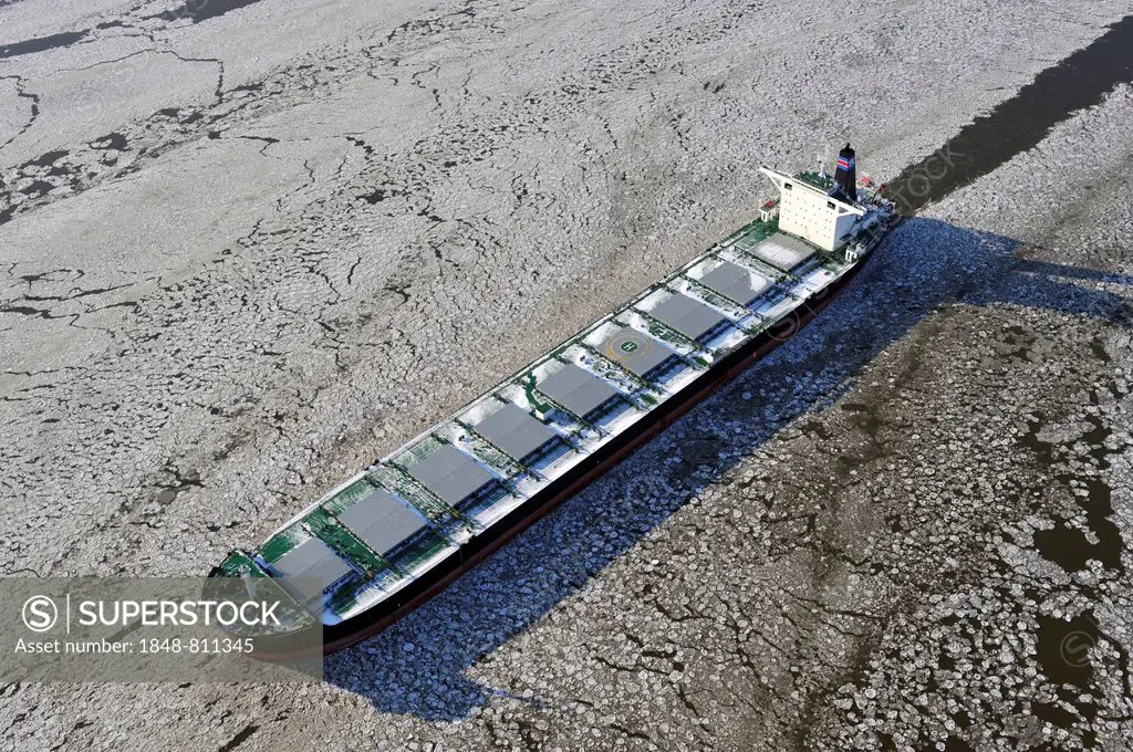 Cargo ship Prosperous on the Elbe River with ice flow, aerial view, Hamburg, Hamburg, Germany