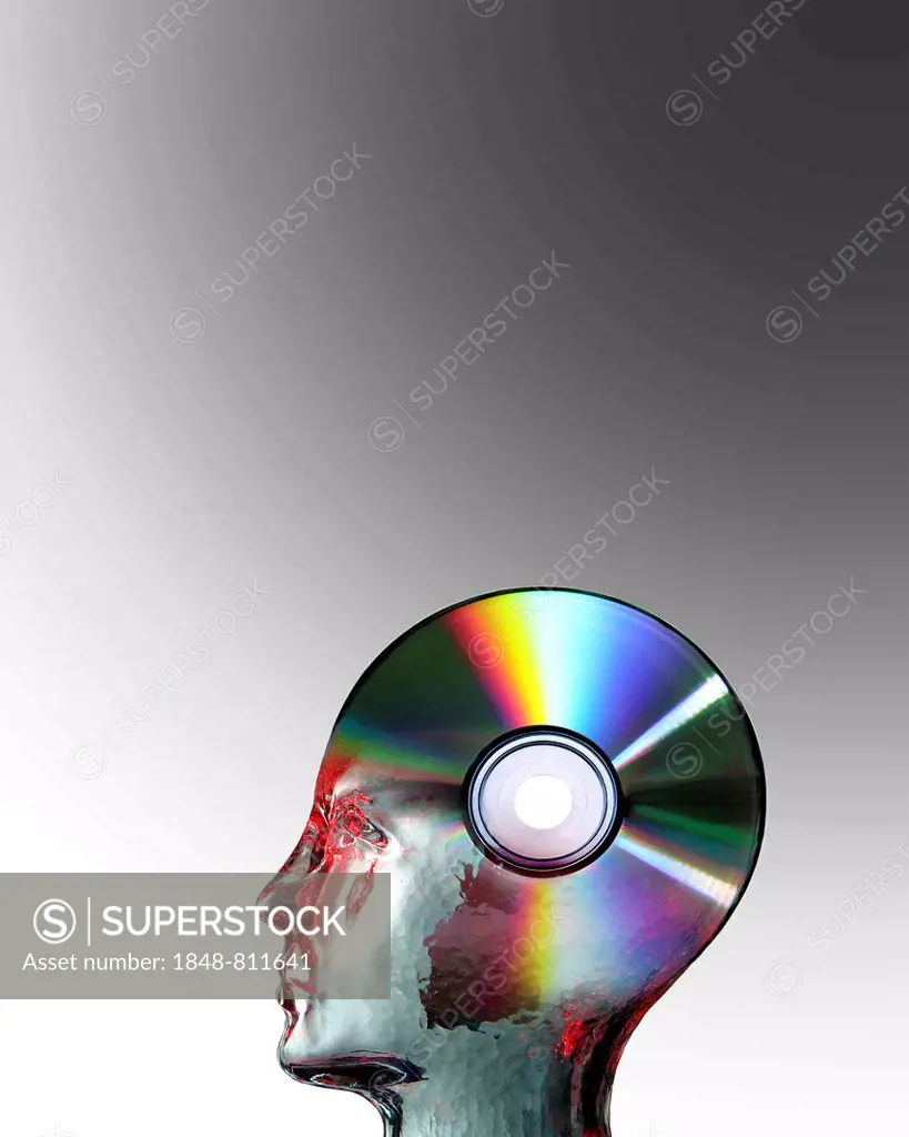 Glass head superimposed on a blank CD, symbolic image for intellectual property, Germany