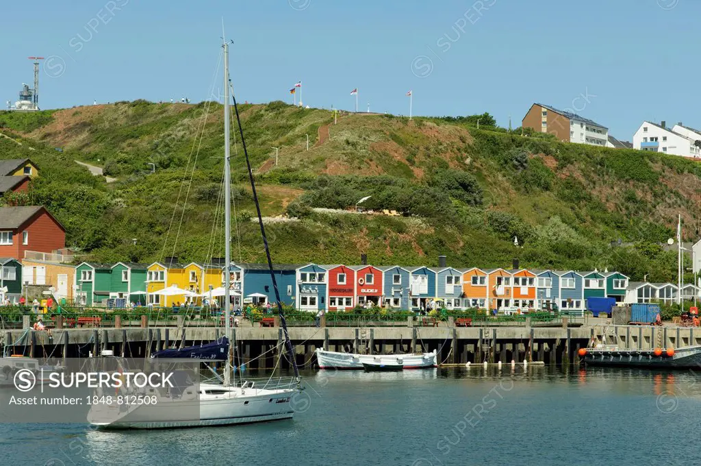 Sailing ship in the harbour of Heligoland or Helgoland in front of Hummerbuden or lobster shacks, Helgoland, Schleswig-Holstein, Germany