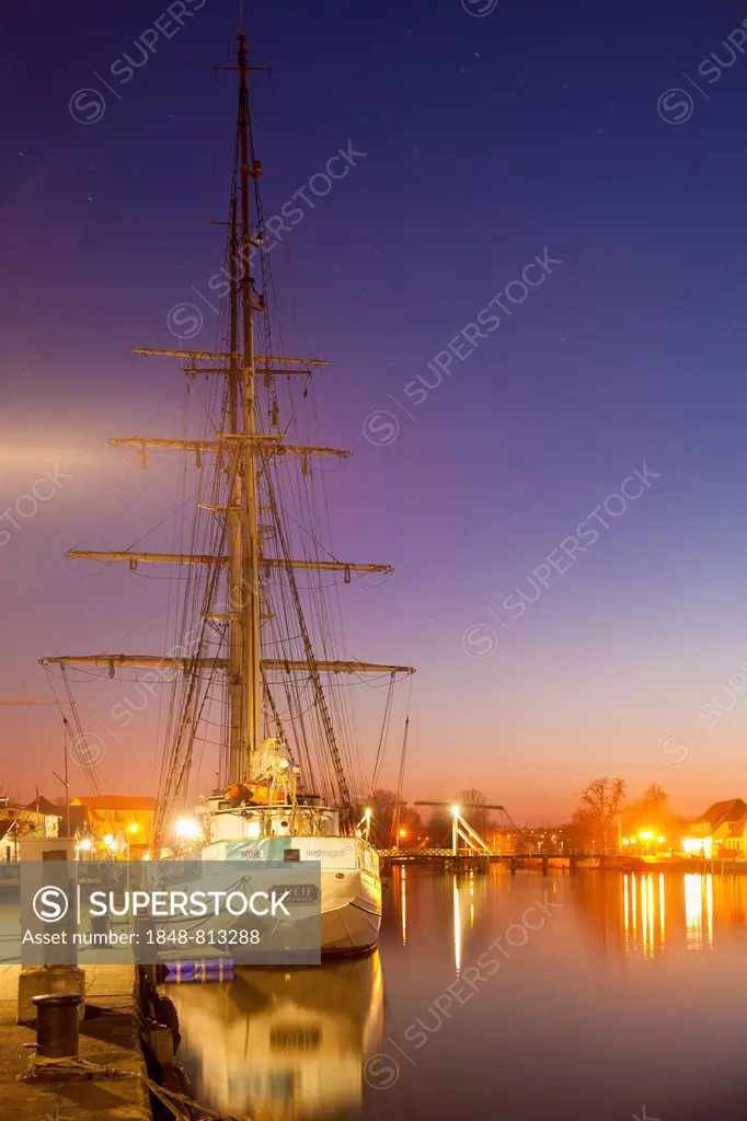 Sailing ship in the fishing port at dusk, Wieck, Greifswald, Mecklenburg-Western Pomerania, Germany