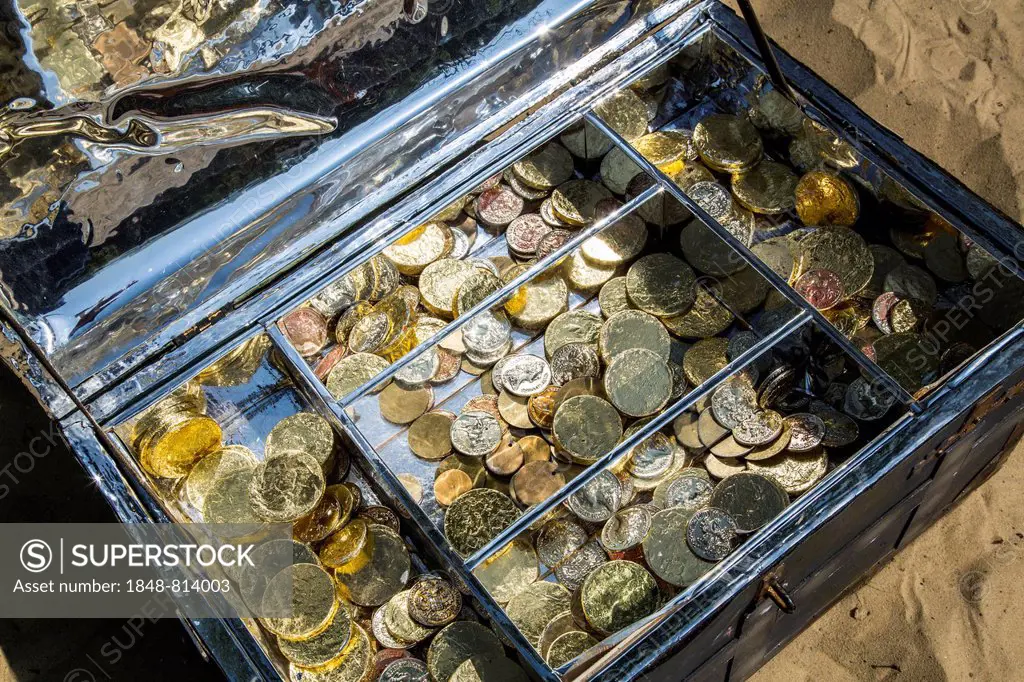 Treasure chest with gold and silver coins