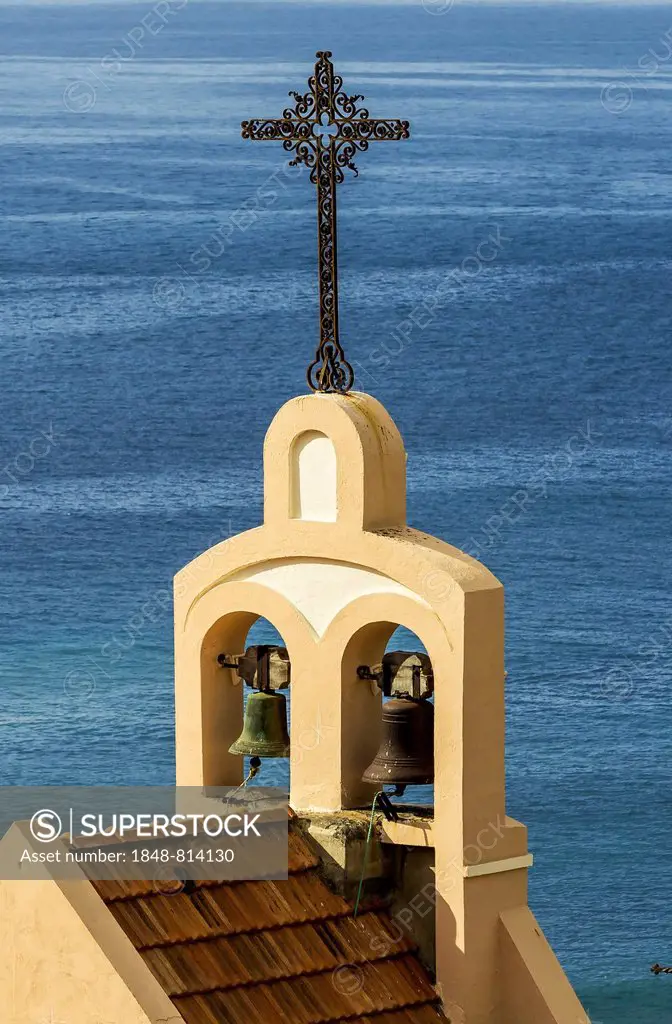 Steeple of the Church of Santiago Apostol, behind the sea, Laguna de Santiago, La Gomera, Canary Islands, Spain