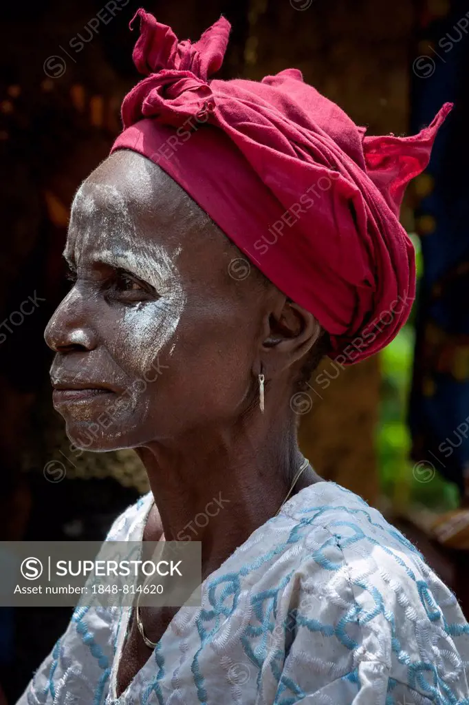 Woman with a headscarf and white paint on her face, Tiwai Island, Southern Province, Sierra Leone