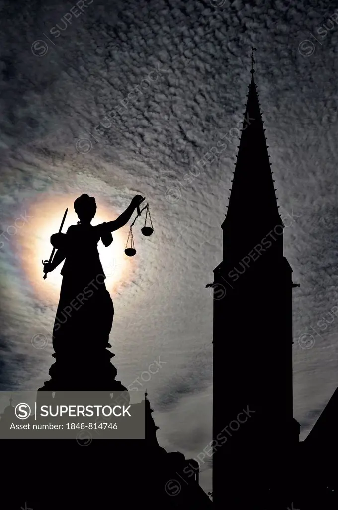 Justitia statue in front of the silhouette of the Old St. Nicholas Church, Frankfurt am Main, Hesse, Germany