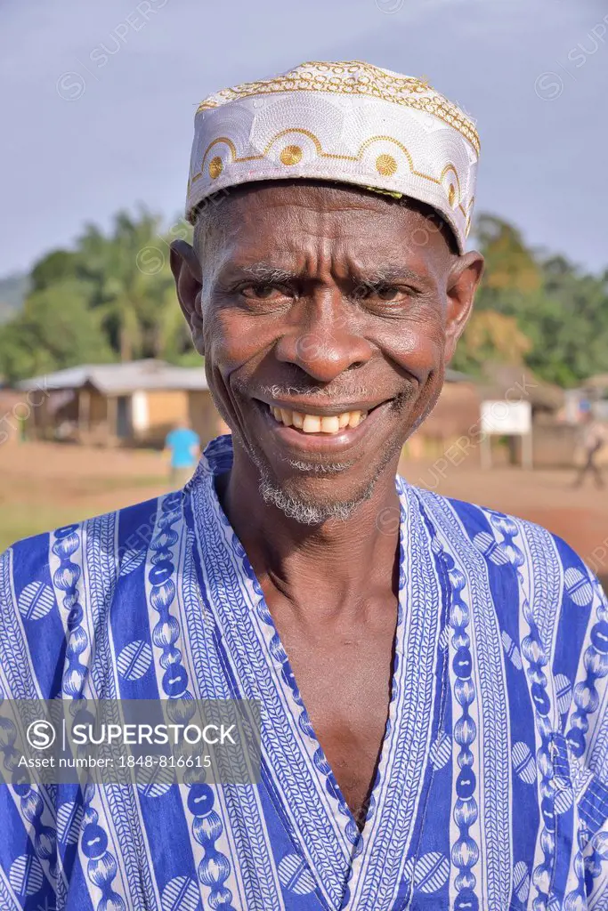Portrait of a smiling man in Muslim dress, Muslim, Waiima, Kono District, Sierra Leone