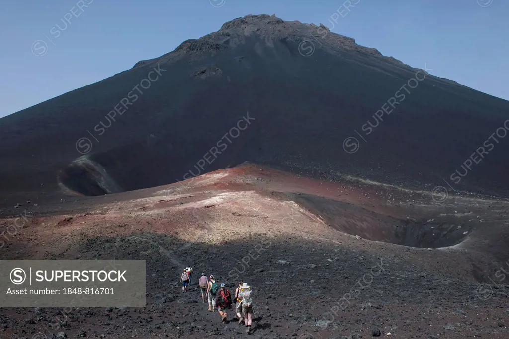 Hikers in the volcanic landscapes of the volcano Pico do Fogo, Fogo National Park, Fogo island, Cape Verde