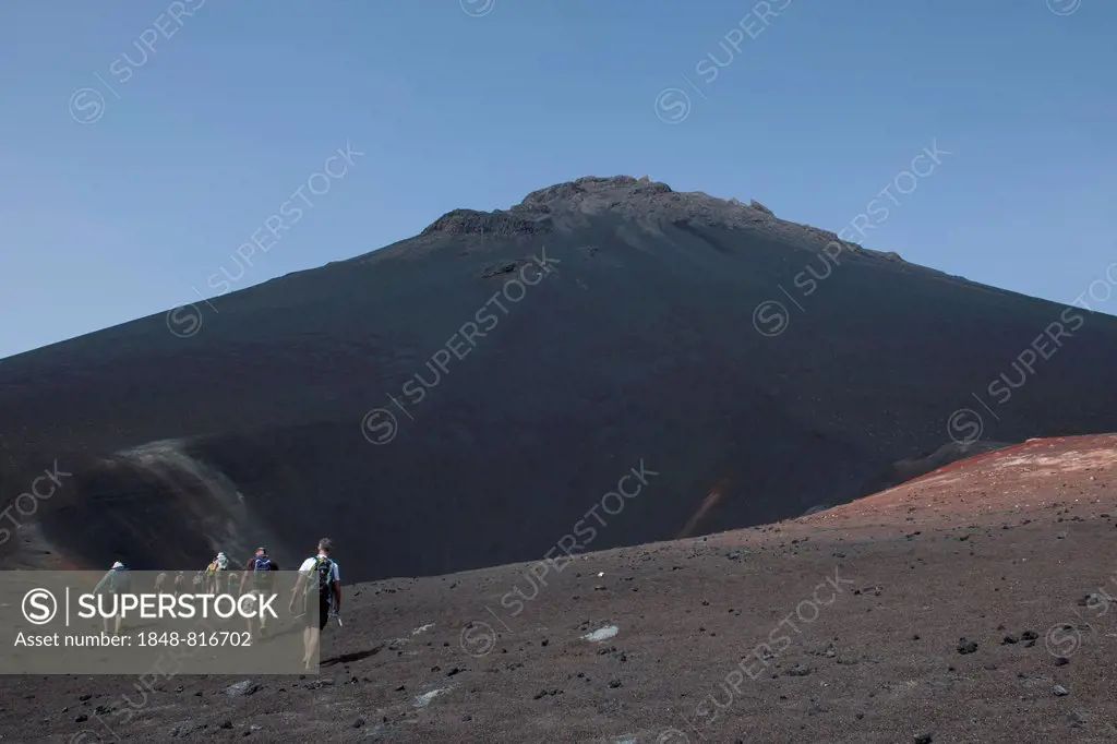 Hikers in the volcanic landscapes of the volcano Pico do Fogo, Fogo National Park, Fogo island, Cape Verde