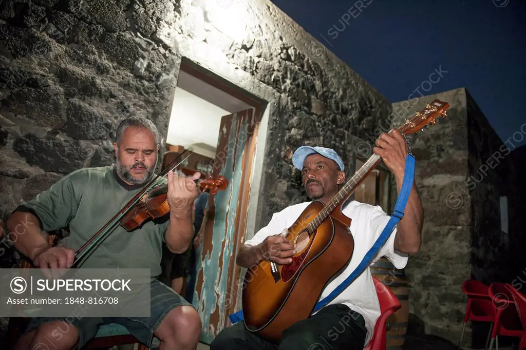 Musicians in front of a tavern, Fogo island, Cape Verde