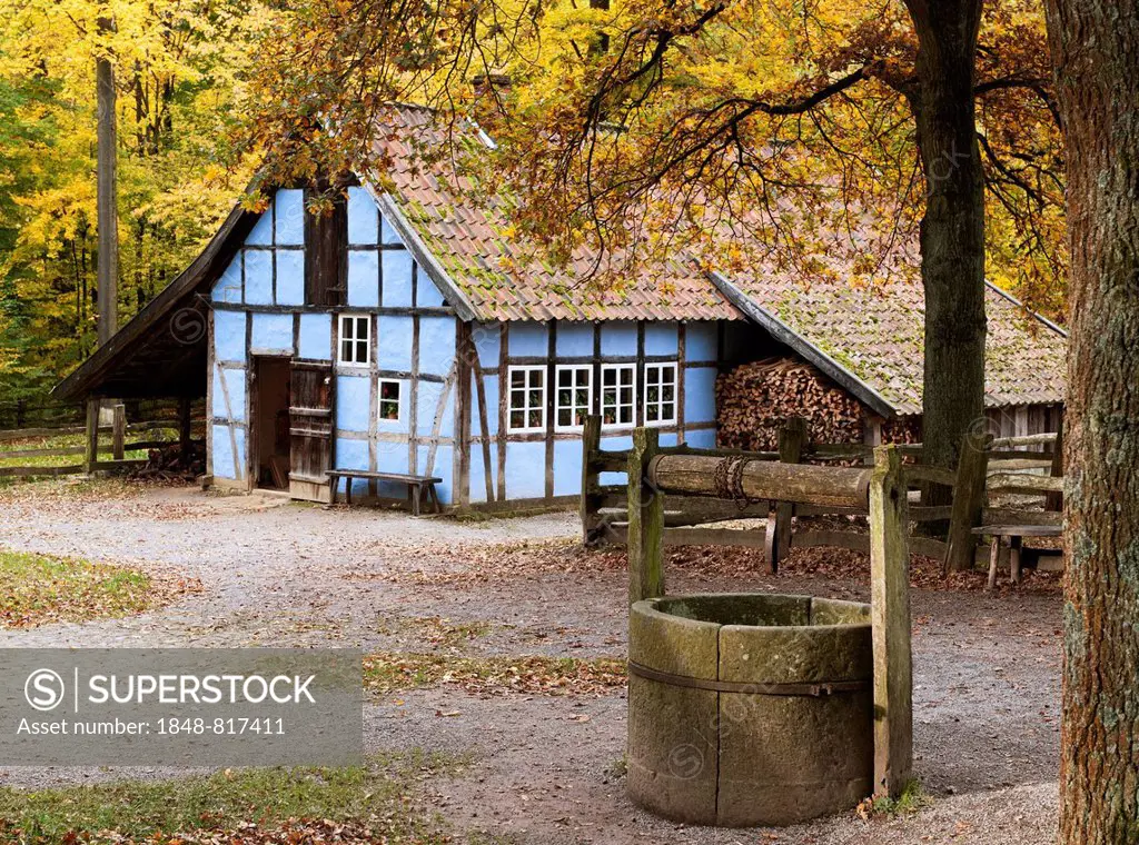 Historical pottery workshop from the 19th century with a well in autumn, Freilichtmuseum Detmold or Open-Air Museum Detmold, North Rhine-Westphalia, G...