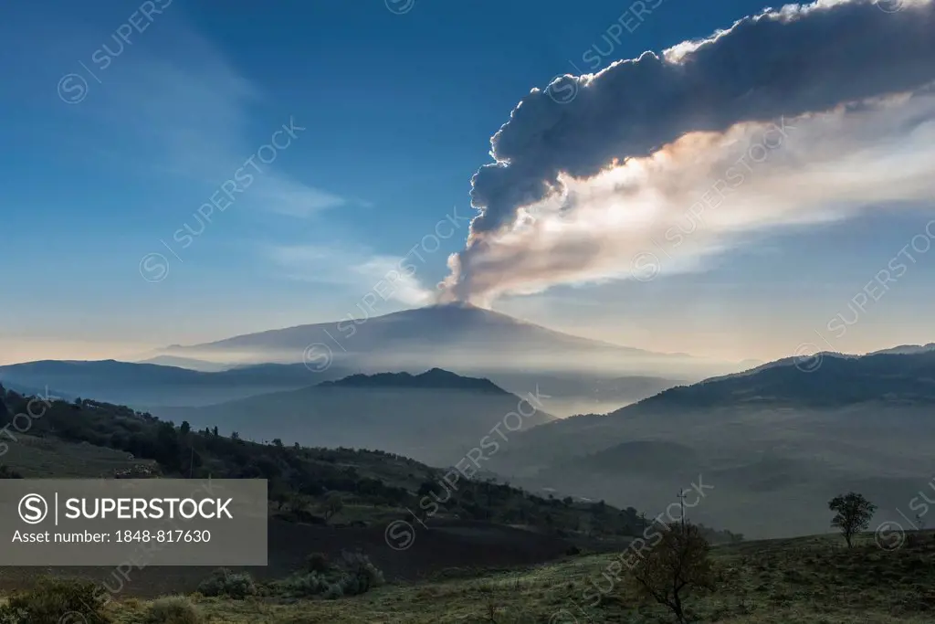 Eruption column above the new southeast crater, foggy landscape, Mount Etna, at Cesarò, Sicily, Italy