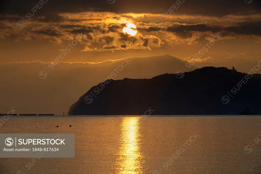 Sunrise over the Tyrrhenian Sea, behind the Capo Tindari mountains, San Giorgio, Messina province, Sicily, Italy Province