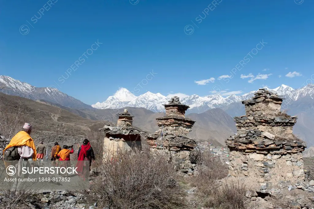 Hindu pilgrims, old chortens, Tibetan Buddhism and Hinduism, Mt Dhaulagiri, 8167 m, at back, Muktinath temple district, Lower Mustang, Nepal