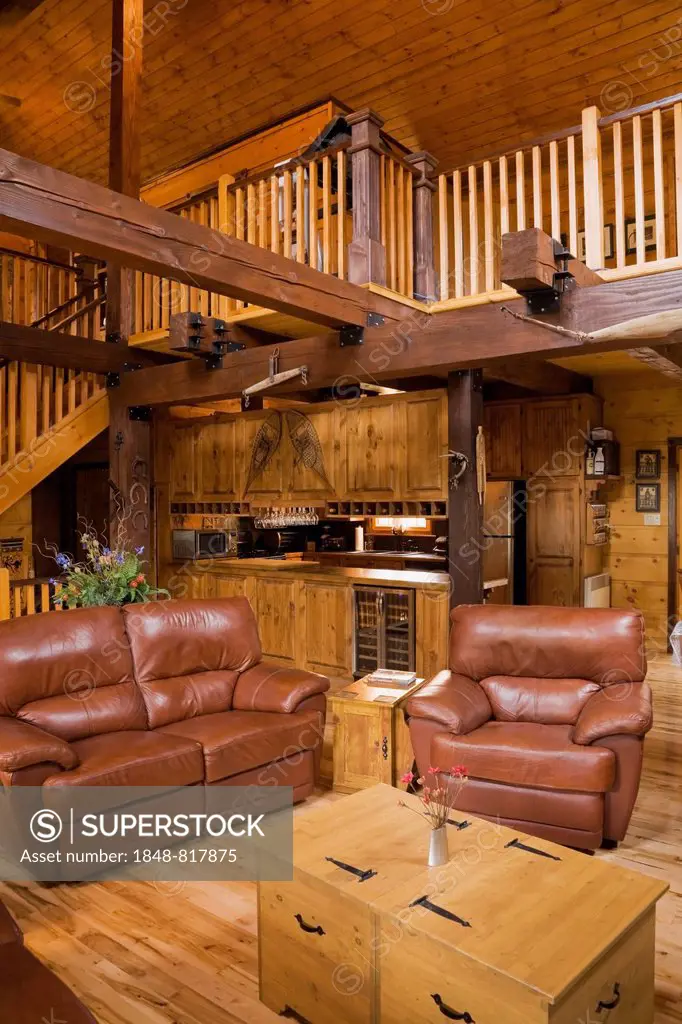 Living room inside a Canadiana cottage, a white pine log home, Quebec Province, Canada