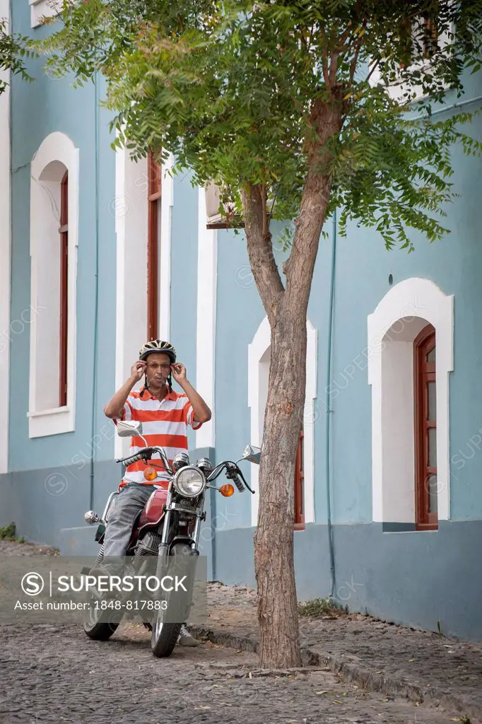 Man sitting on a motorcycle, Sío Filipe, Fogo Island, Cape Verde