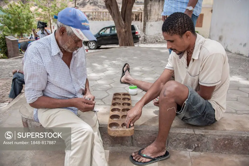 Men playing a board game, Santo Antío, Cape Verde