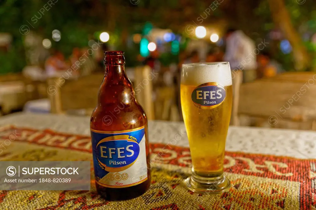 Efes Pilsen beer bottle and beer glass, Dalyan, Mugla Province, Turkish Riviera or Turquoise Coast, Aegean, Turkey