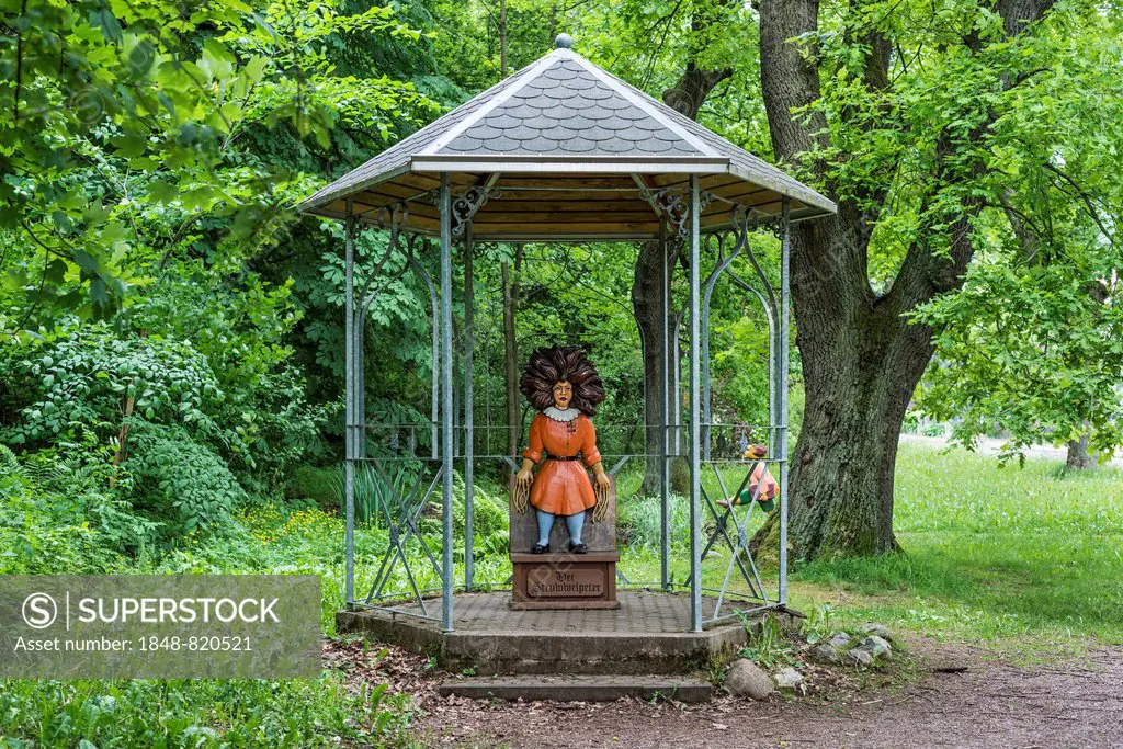 Gazebo with the Title character from the Struwwelpeter children's book by Heinrich Hoffmann, carved in wood by Guenther Gerke, , Struwwelpeter Park, T...