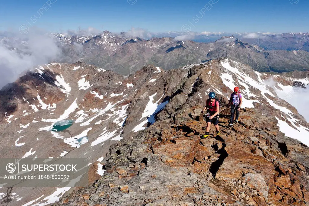 Mountaineers during the ascent to Mt Hintere Eggenspitze via the summit ridge, in Ultental Valley or Val d'Ultimo, South Tyrol, Italy