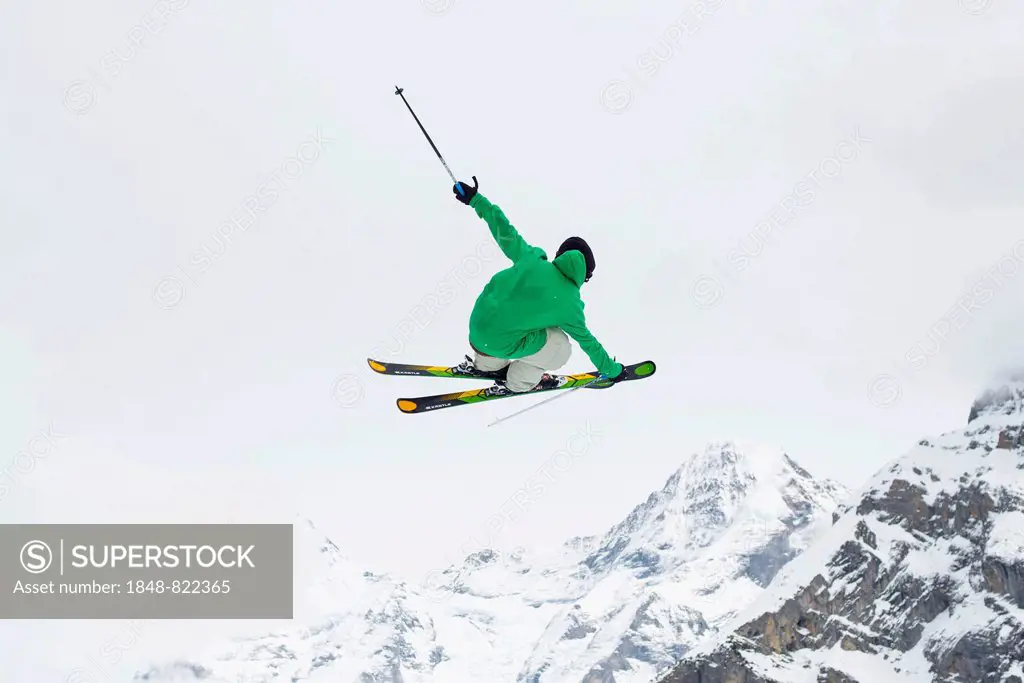 Trick skier jumping, in front of Eiger Mountain, Mürren, Bernese Oberland, Canton of Bern, Switzerland