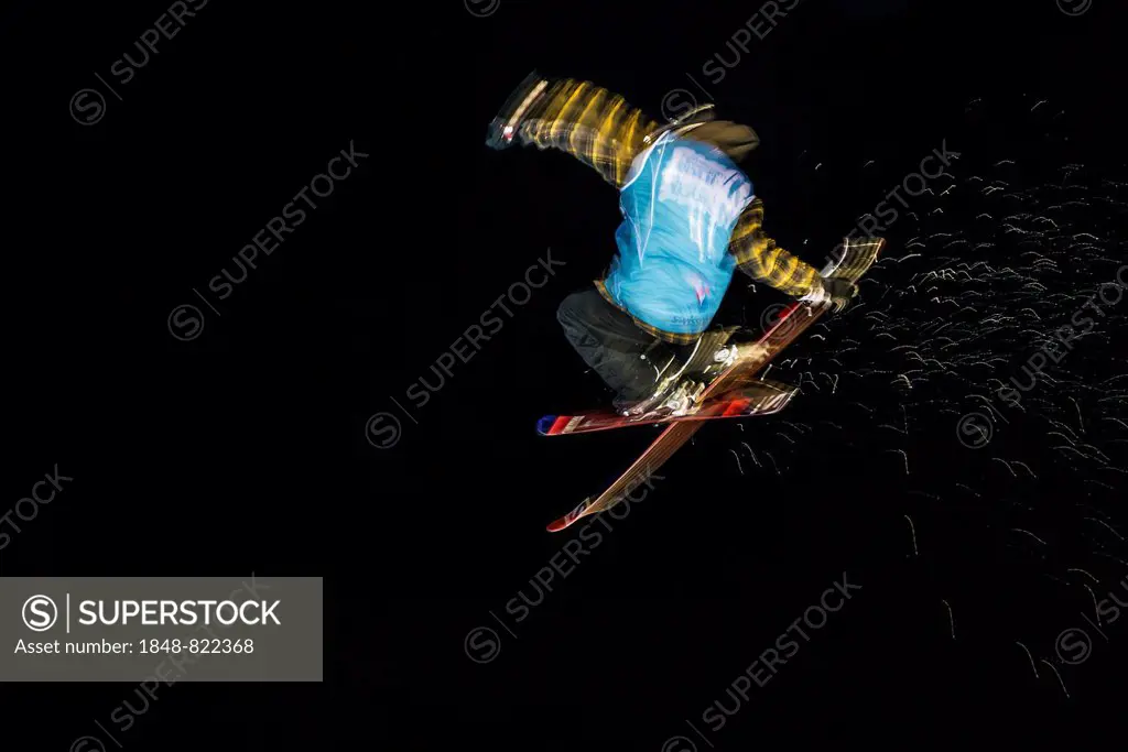 Trick skier with motion blur, night shot, Mürren, Bernese Oberland, Canton of Bern, Switzerland