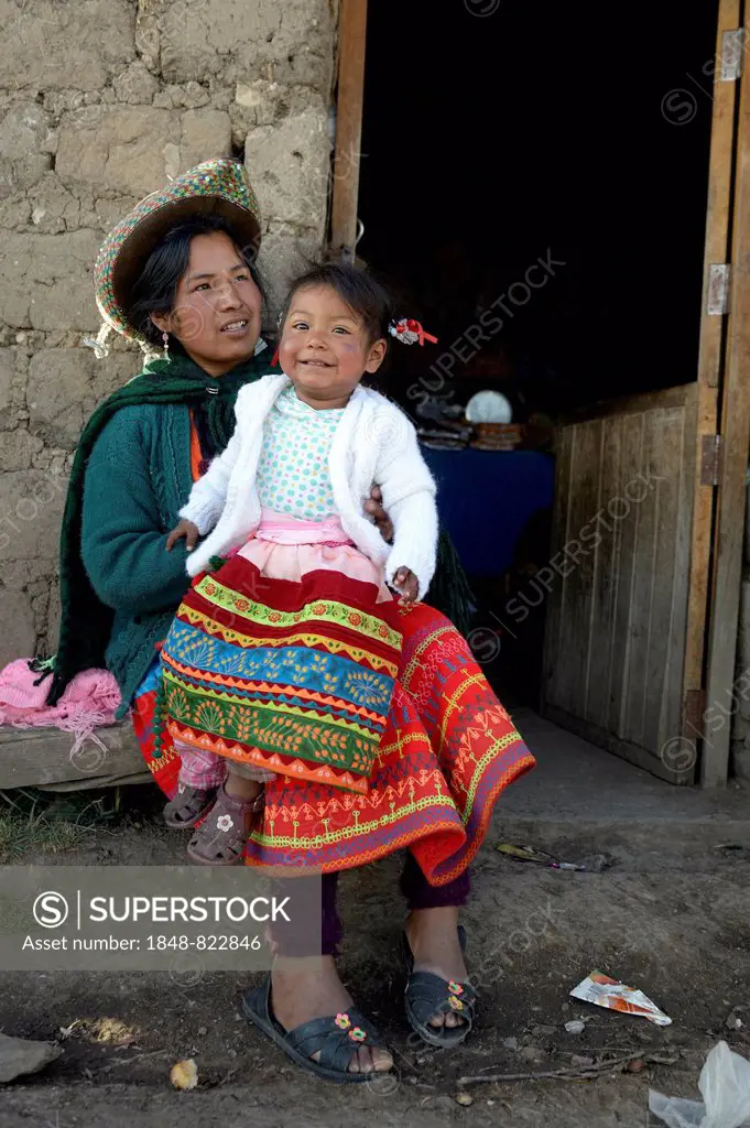 Young woman with girl in traditional costume, Union Potrero, Quispillacta, Ayacucho, Peru