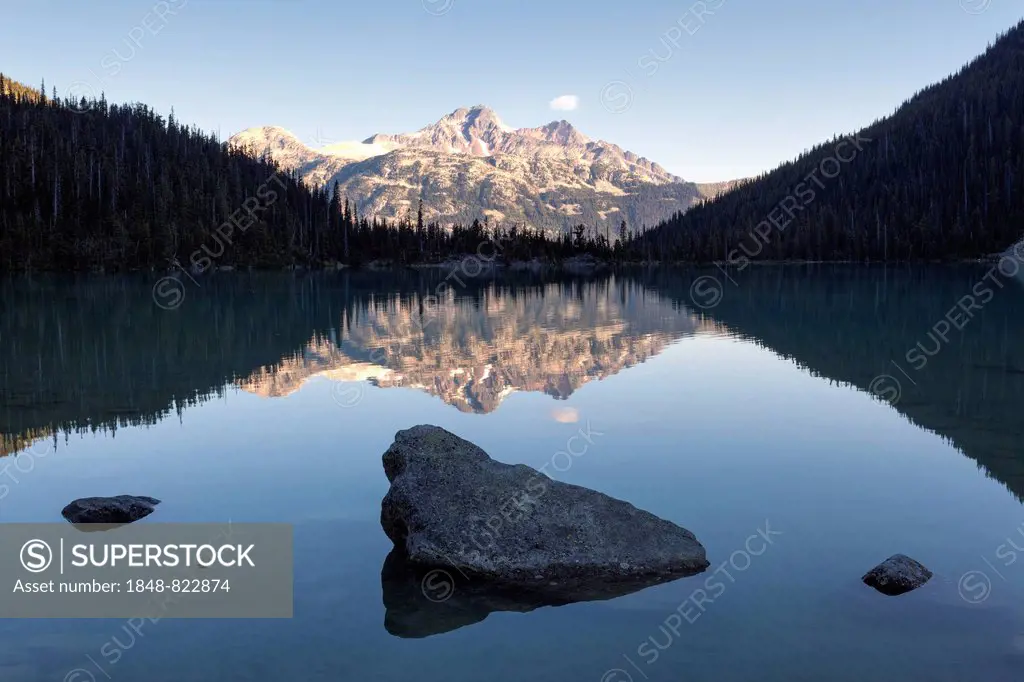 Early morning, mountains with reflections in Upper Joffre Lake, Joffre Lakes Provincial Park, Canada