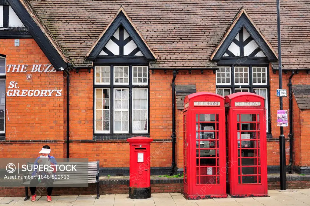 Red telephone booths and a red post box, Stratford-upon-Avon, Warwickshire, England, United Kingdom