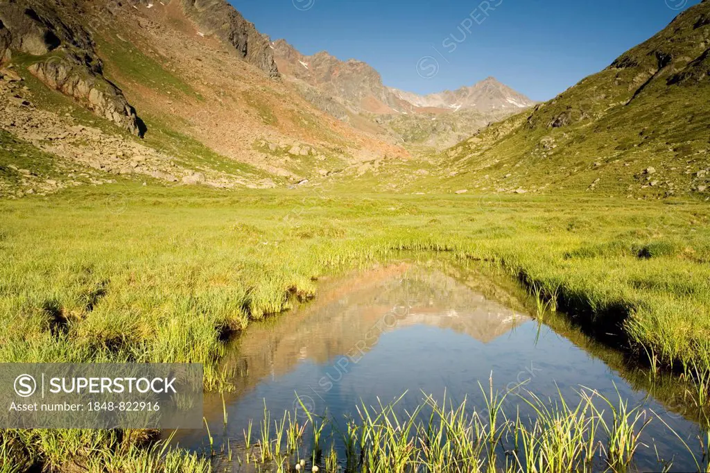 Mountain range reflected in Tumpen, Kaunertal, North Tyrol, Austria