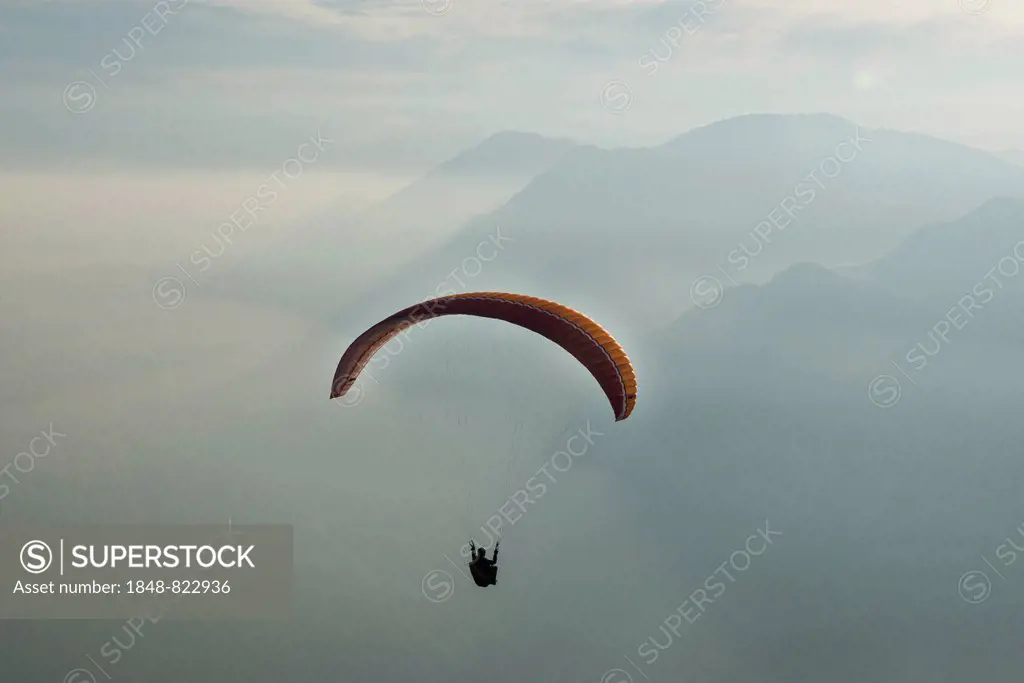 Paragliding, paraglider, clouds, inversion, Lake Garda, Veneto, Italy