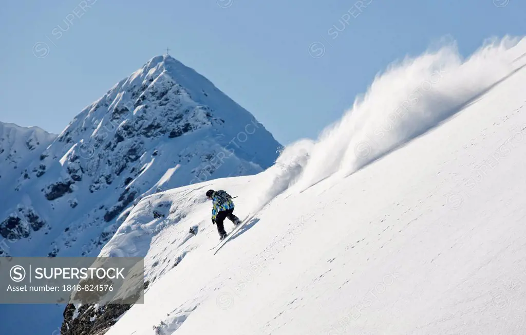 Freerider, snowboarder descending, in front of Standkopf Mountain, Sagtaler Spitze Mountain, Alpbach Valley, Kitzbühel Alps, North Tyrol, Austria