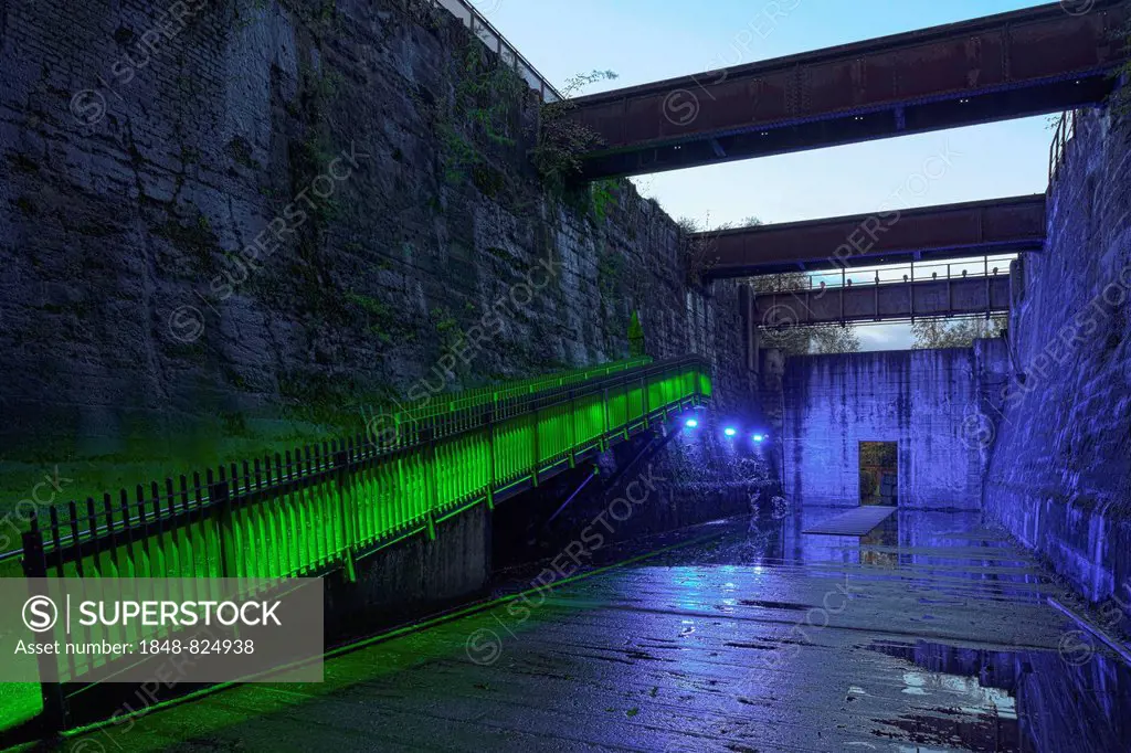 Illuminated former coal bunkers, disused steelworks, Landscape Park Duisburg-Nord, Ruhr area, North Rhine-Westphalia, Germany