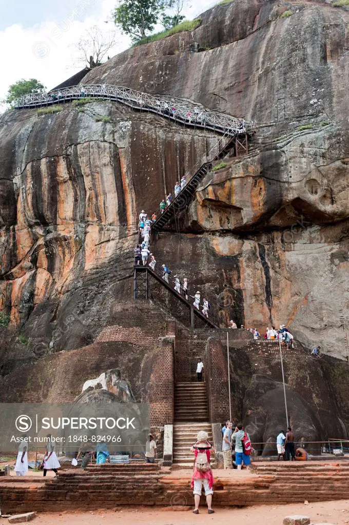 Visitors climbing the steep stairs to the rock fortress of Sigiriya, UNESCO World Heritage Site, Sigiriya, Sri Lanka